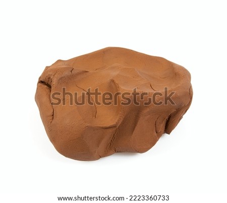 Natural clay piece isolated on white background. Wet clay material for sculpting or modeling. Royalty-Free Stock Photo #2223360733