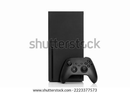 Black next generation game console and controller. Royalty-Free Stock Photo #2223377573