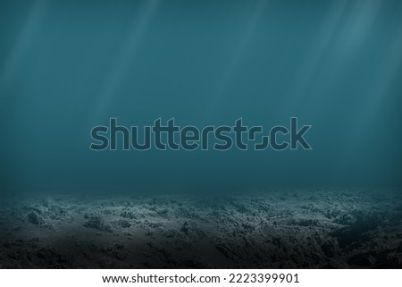 Dark blue ocean seen from underwater. Dead seabed of stones and rocks Royalty-Free Stock Photo #2223399901