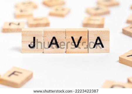 JAVA word on wooden cube blocks. JAVA modern programming language for software development or application concept