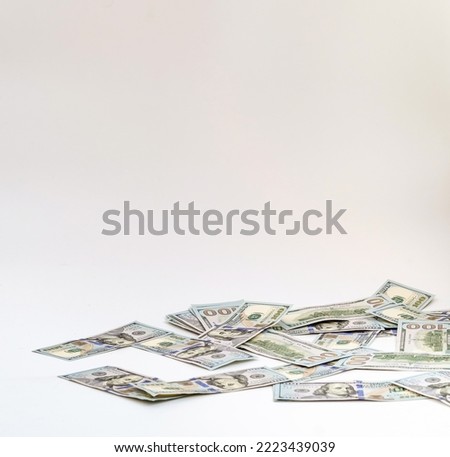 Falling paper money dollar bills on white background