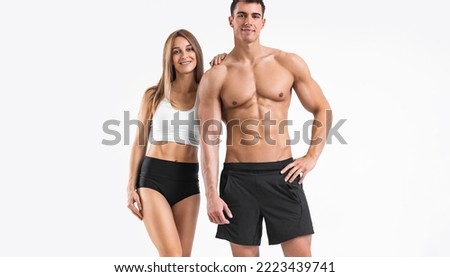 Fit couple at the gym isolated on white background. Fitness concept. Healthy life style. Fitness-Related Materials for Your Social Media Marketing Campaigns