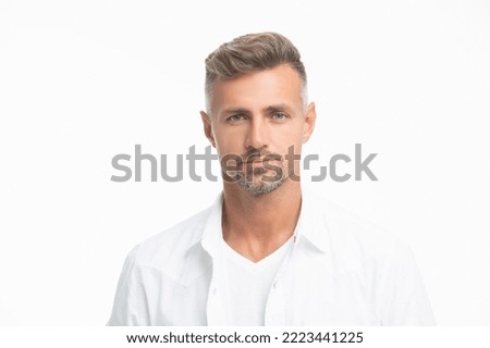 studio shot of handsome unshaven man face. mature unshaven man portrait isolated on white
