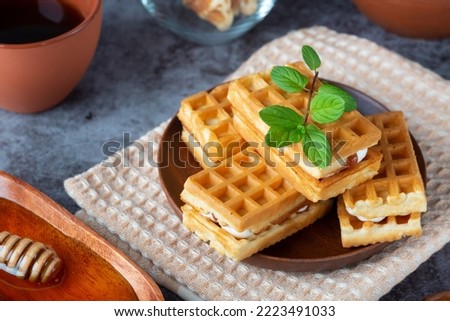 Breakfast with waffles, honey and coffee