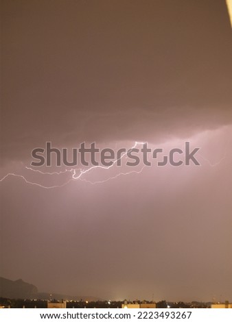 Lightning between clouds in the sky