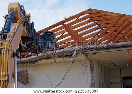 Deconstruction site with tearing down of an apartment building with wooden roof framework on a sunny autumn day. Photo taken November 7th, 2022, Zurich, Switzerland. Royalty-Free Stock Photo #2223503887