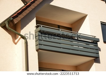 Balcony with high grade Steel Handrail and coated aluminium Panels at the Front of a  modern residential Building