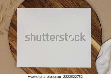 Letter size paper mockup, blank sheet on the wooden board, top view
