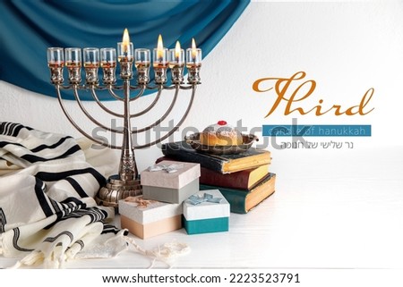 Thrid candle of Hanukkah (Lettering in English and Hebrew)  with Menorah (traditional candelabra). Jewish religious holiday