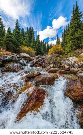 Mountain waterfall water flowing on stone Royalty-Free Stock Photo #2223524745