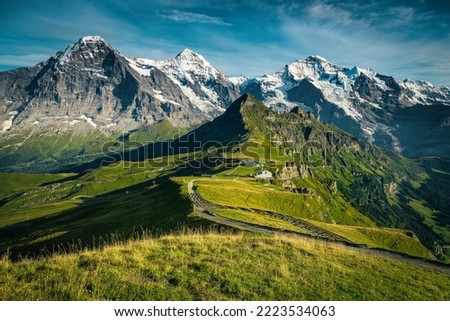 One of the most beautiful mountain view from the Mannlichen station. Picturesque snowy mountain ridges and deep valleys with green fields, Lauterbrunnen valley, Bernese Oberland, Switzerland, Europe Royalty-Free Stock Photo #2223534063