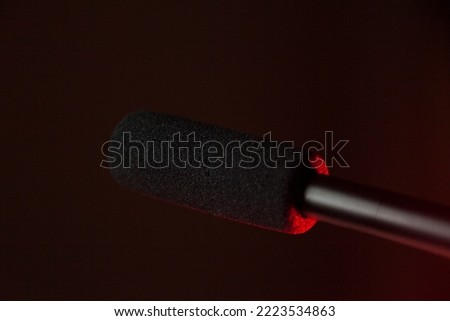 Podcast microphone on colored background with copy space. mic in studio. Microphone concept. Podcast concept.