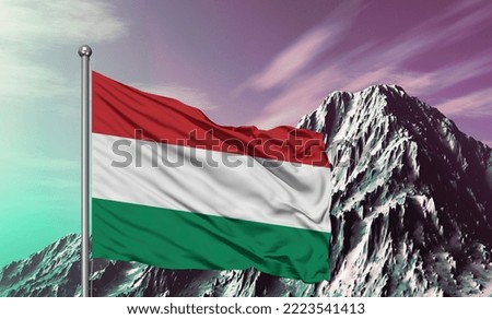 Hungary national flag cloth fabric waving on beautiful Mountain Background.