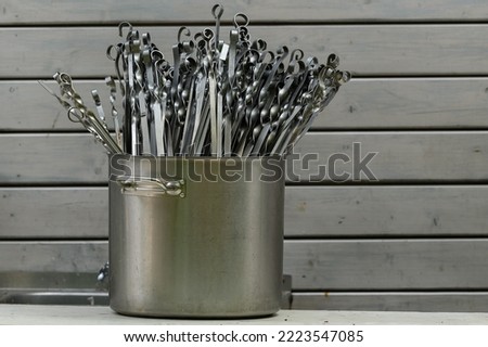 Stainless Steel barbecue Skewers, Clean skewers are in a large pot after washing
