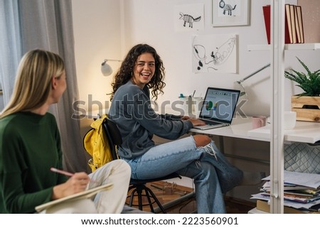 college female students studying in room Royalty-Free Stock Photo #2223560901