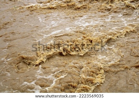 raging waters after a storm. metsimaswaane river south of Botswana
