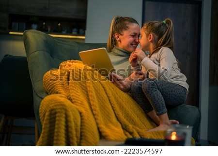 Mother and daughter sharing affection, there are spending some quality time together over the winter break Royalty-Free Stock Photo #2223574597