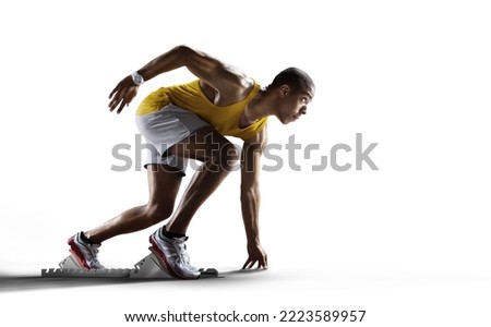 Sport white background. Sprinter leaving starting blocks on the running track. Royalty-Free Stock Photo #2223589957