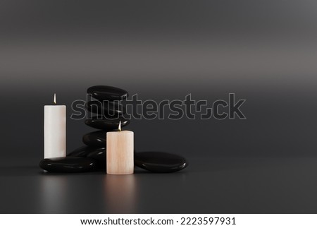Black massage stones and candles on a dark background. The concept of massaging, realking. SPA and beauty care. 3D render, 3D illustration.