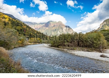 Azusa river flows through Kamikochi, into the Matsumoto Basin. The river itself flows from a spring located deep within Mt. Yari, perhaps the most famed peak in the Northern Alps. Royalty-Free Stock Photo #2223620499