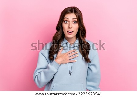 Photo of shocked young lady open mouth arm touch chest isolated on pink color background