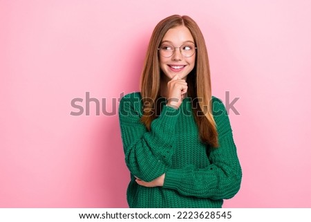 Closeup photo of young positive toothy smile girl touch chin dreamy looking empty space minded genius idea wear glasses isolated on pink color background