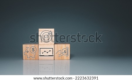 Wood cube block stacking with icon.Concept of business strategy and goal action plan. 