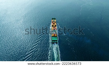 cargo maritime ship with contrail in the ocean ship carrying container and running for export concept technology freight shipping by ship smart service forwarder. Stern of container ship