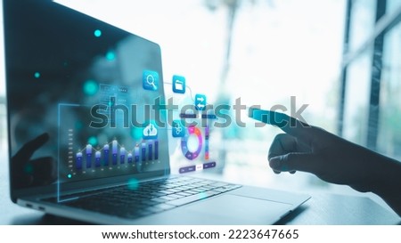 businessman pointing to analyst working with Business Analytics and Data Management System on virtual screen, connected to database. Corporate strategy for finance, operations, sales, marketing. Royalty-Free Stock Photo #2223647665