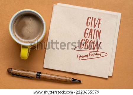 give, gain and grow - Giving Tuesday, business and personal development concept - handwriting on a napkin with a cup of coffee Royalty-Free Stock Photo #2223655579