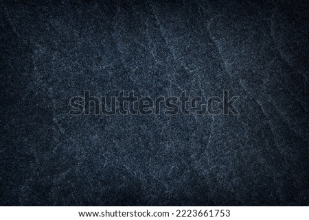 Dark grey stone or black slate stone background or texture
