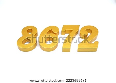    Number 8672 is made of gold-painted teak, 1 centimeter thick, placed on a white background to visualize it in 3D.                                    
