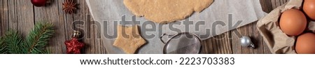 banner of Baking homemade Christmas gingerbread cookies. top view of holiday background with dough spices and fir tree. Preparing for christmas concept