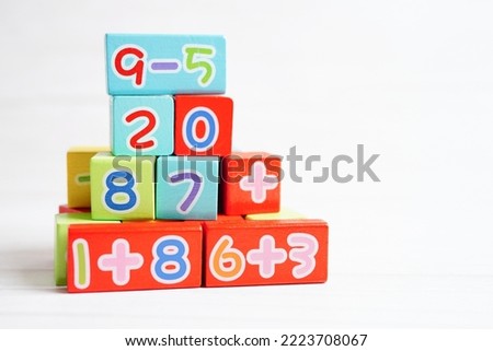 Number wood block cubes for learning Mathematic, education math concept.