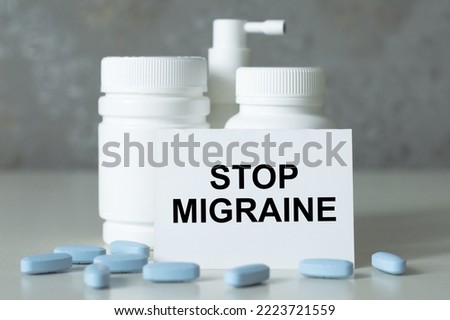 Text on a card Stop Migraine, medical concept