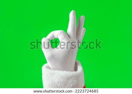 Santa Claus Hands Making Victory Sign and OK Gesture Isolated On Green Background. Close Up. Christmas Congratulation. Chroma Key Screen. Everything is Good. Proposing product. Gestures Pack