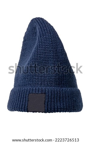 Dark blue fashionable knitted Rapper, Beanie or Baseball hat or cap isolated on white background. Clipping path. Macro. Fishing or Dockworkers hood. Label space.