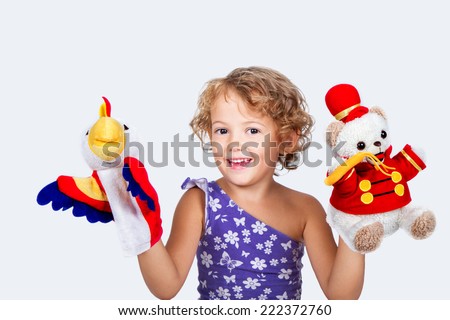 Beautiful girl with puppets Royalty-Free Stock Photo #222372760