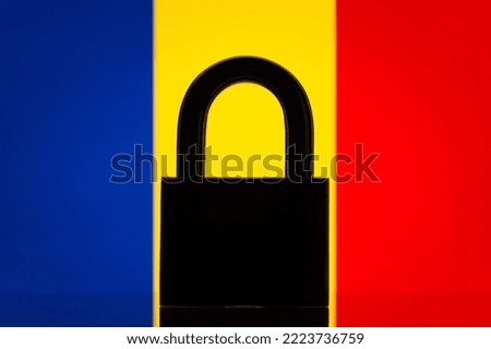 Lock against flag of Romania. Conceptual photo of big closed lock and flag of Romania, closed country concept, embargo, sanctions