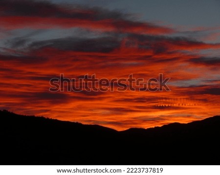 fiery sunset over the hills