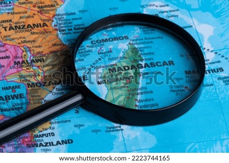 Map of Madagascar through magnifying glass.Close-up