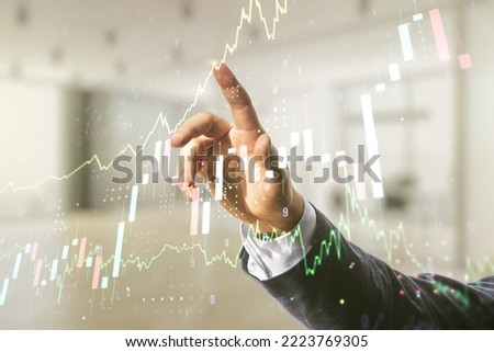 Multi exposure of analyst hand with pen working with virtual abstract financial diagram on blurred office background, banking and accounting concept