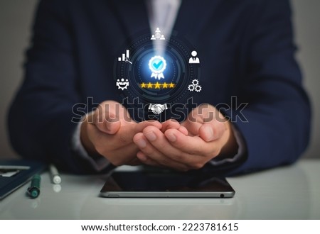 Quality Assurance Concept. Business people show high quality assurance mark, good service, premium, five stars, premium service assurance, excellence service, high quality, excellence guarantee. Royalty-Free Stock Photo #2223781615