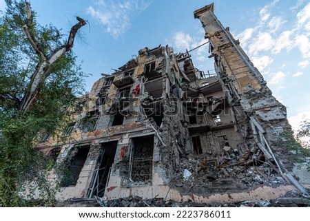 destroyed and burned houses in the city Russia Ukraine war Royalty-Free Stock Photo #2223786011