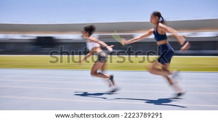 Relay race, running and sports women at a stadium for training, energy and workout. Sport, runner and baton pass on a running track by athletic team for fitness, marathon and speed performance Royalty-Free Stock Photo #2223789291