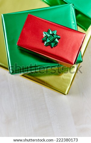 Shiny gift boxes on wooden table, top view