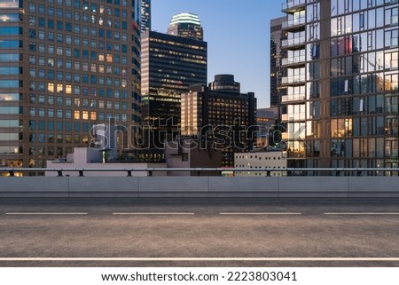 Empty urban asphalt road exterior with city buildings background. New modern highway concrete construction. Concept of way to success. Transportation logistic industry fast delivery. Los Angeles. USA.