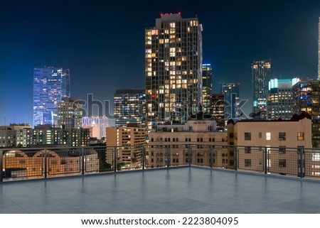 Skyscrapers Cityscape Downtown, Los Angeles Skyline Buildings. Beautiful Real Estate. Night time. Empty rooftop View. Success concept.
