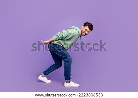 Full size photo of handsome young man carry back heavy object stressed wear trendy gray isolated on violet color background Royalty-Free Stock Photo #2223806533