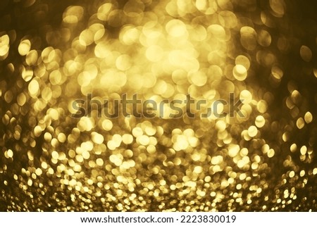Golden glitter bokeh lighting texture Blurred abstract background for birthday, anniversary, wedding, new year eve or Christmas.